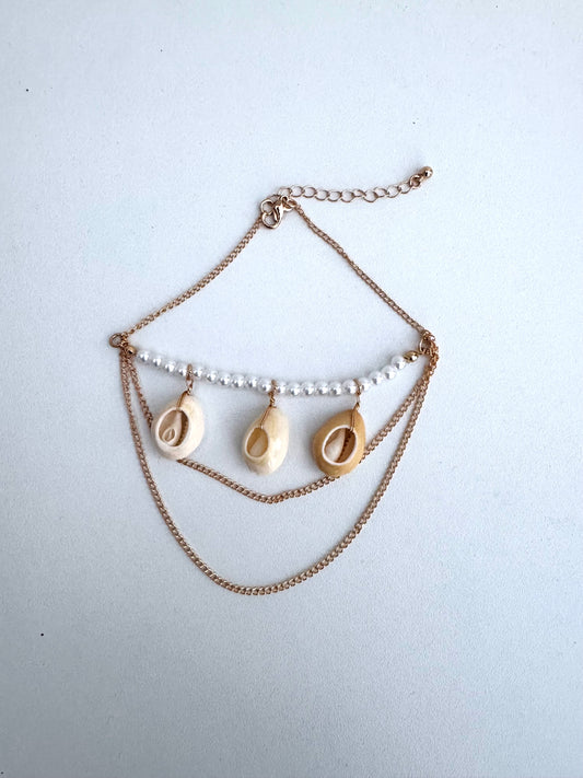Bracelet de bras avec pendentif en perles et coquillages
